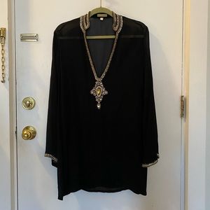 Kareena’s black sheer tunic with beaded neckline and cuffs. Size M.